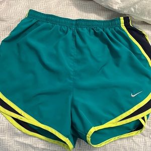 Teal and bright yellow Nike shorts